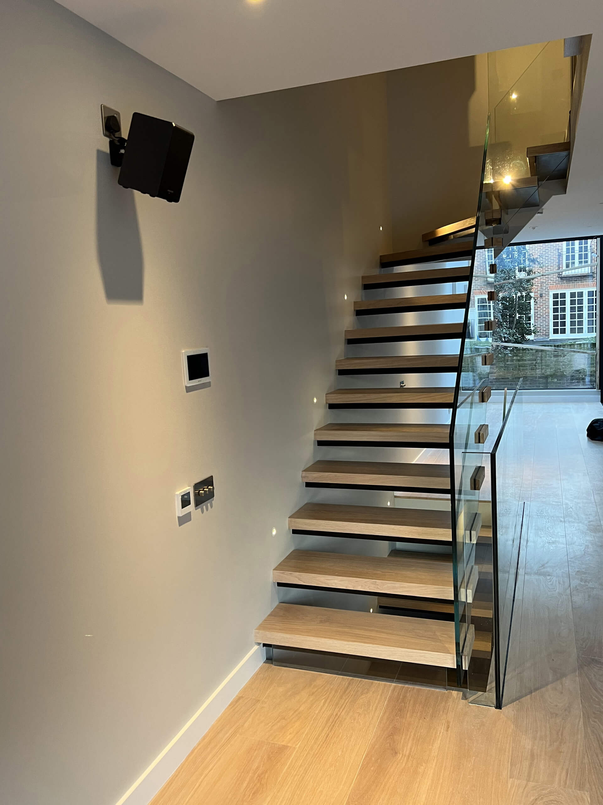 Floating Staircase With Frameless Glass Balustrade And Light Brown Oak Treads (3)