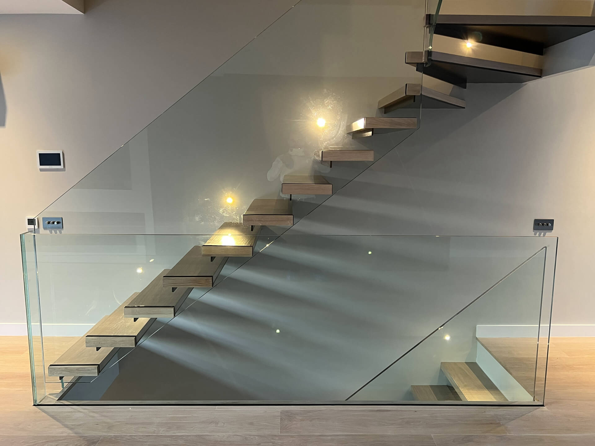 Floating Staircase With Frameless Glass Balustrade And Light Brown Oak Treads (6)