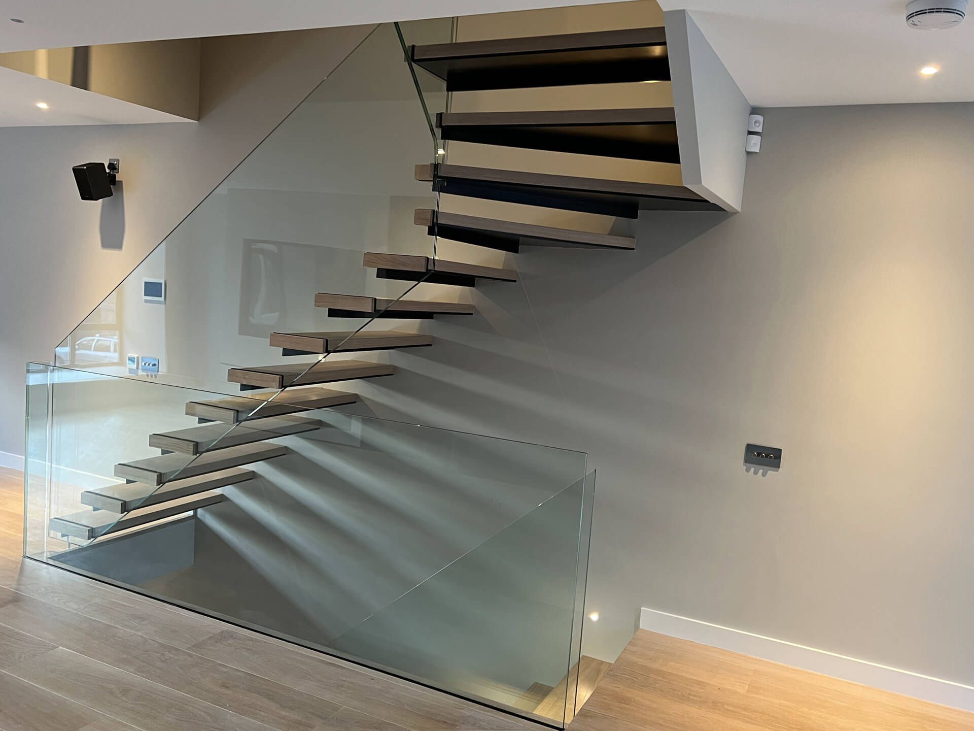 Floating Staircase With Frameless Glass Balustrade And Light Brown Oak Treads (7)
